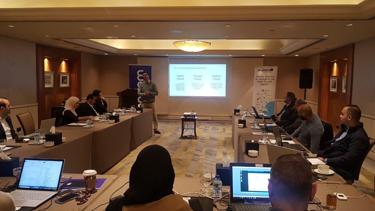 SBEEH Software Academy — Trainer presenting cloud computing deployment models (public, private, and hybrid cloud) to a seated group of IT professionals
