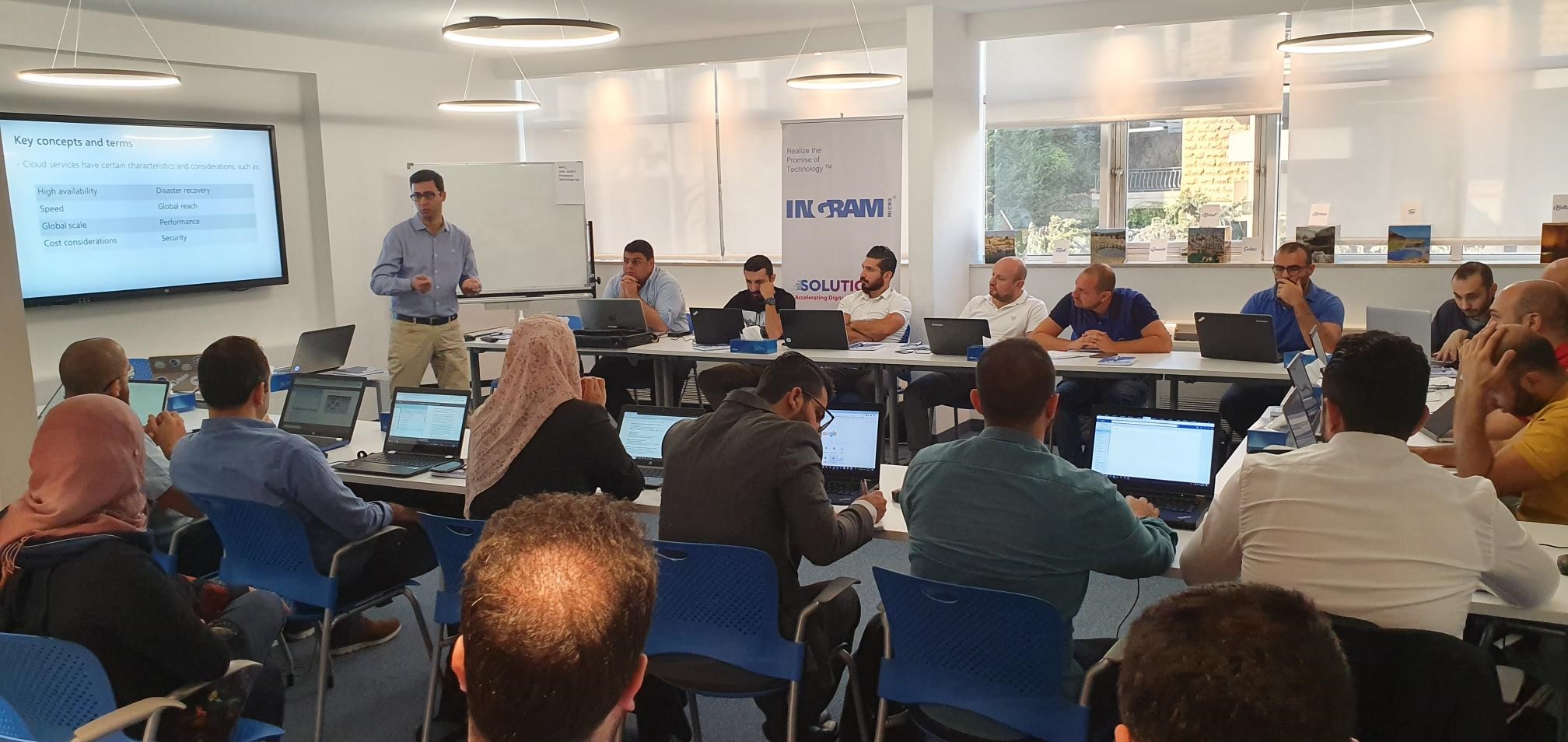 SBEEH Software Academy — Trainer demonstrating a SharePoint photo albums page to a classroom of participants