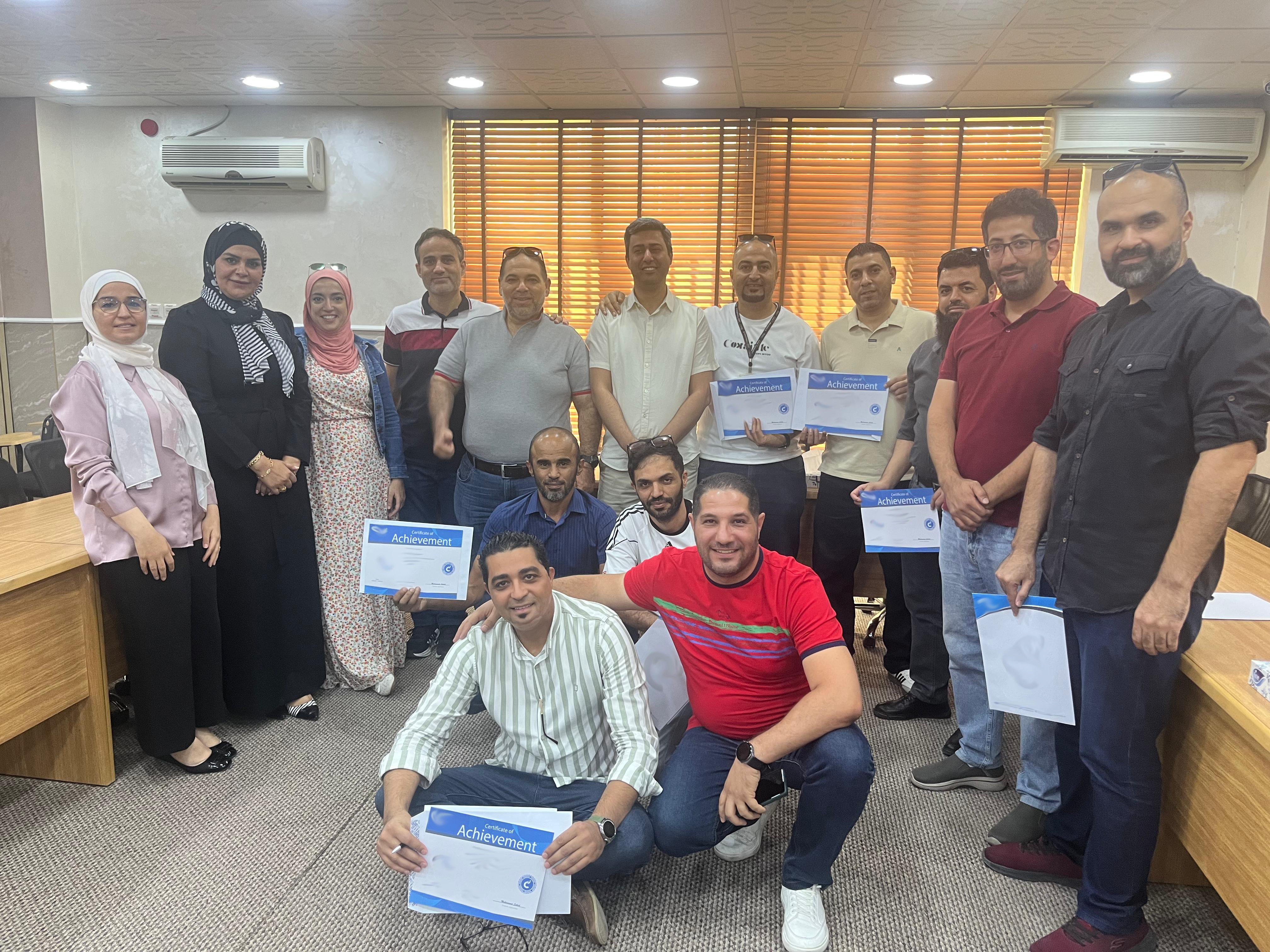 SBEEH Software Academy — Trainer presenting a Microsoft 365 overview to a full classroom of participants with laptops